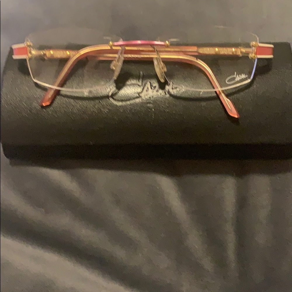 Cazal Pink and Gold Frame glasses.